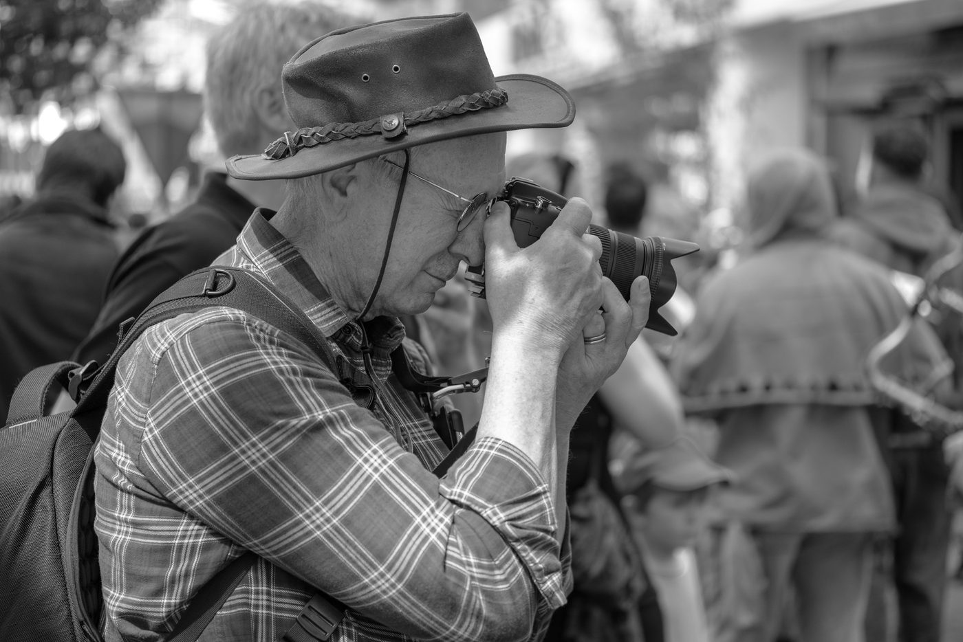 Photographer in action at the Zinneke Parade, Brussels (plate 025)