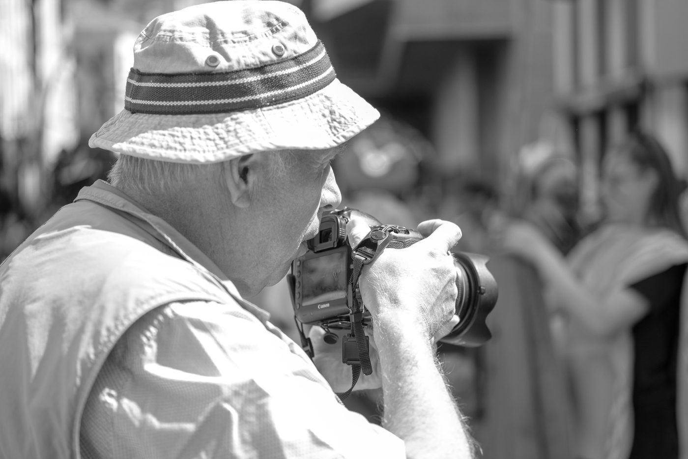 Photographer in action at the Zinneke Parade, Brussels (plate 027)