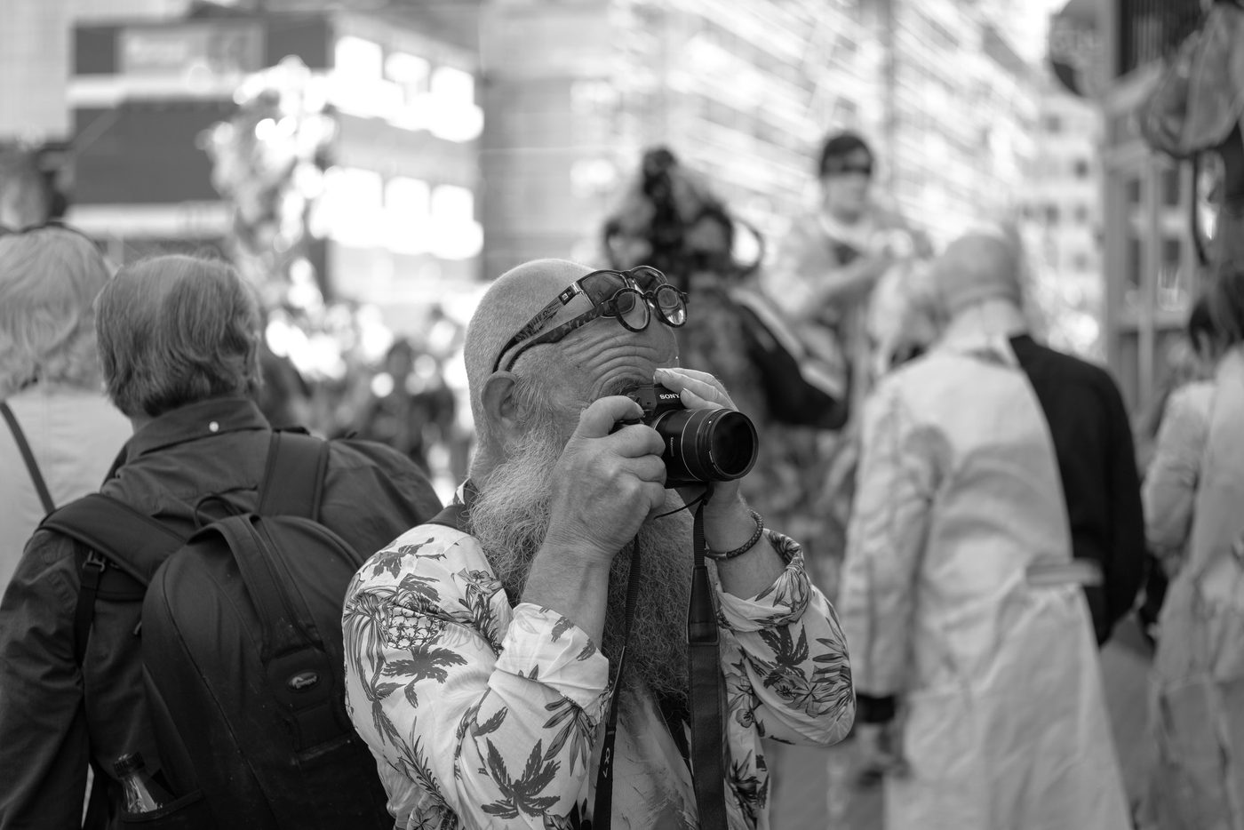 Photographer in action at the Zinneke Parade, Brussels (plate 029)