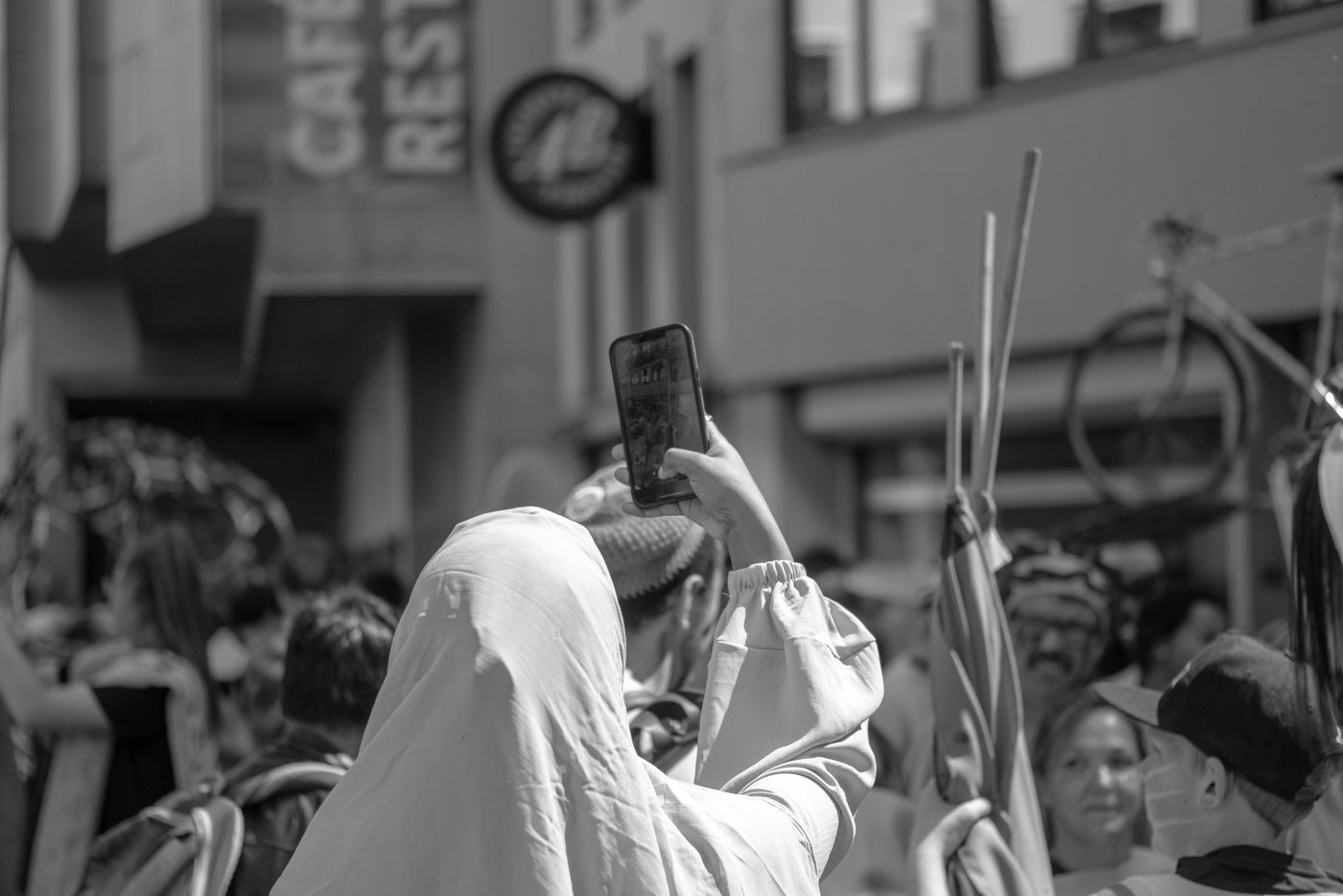 Photographer in action at the Zinneke Parade, Brussels (plate 030)