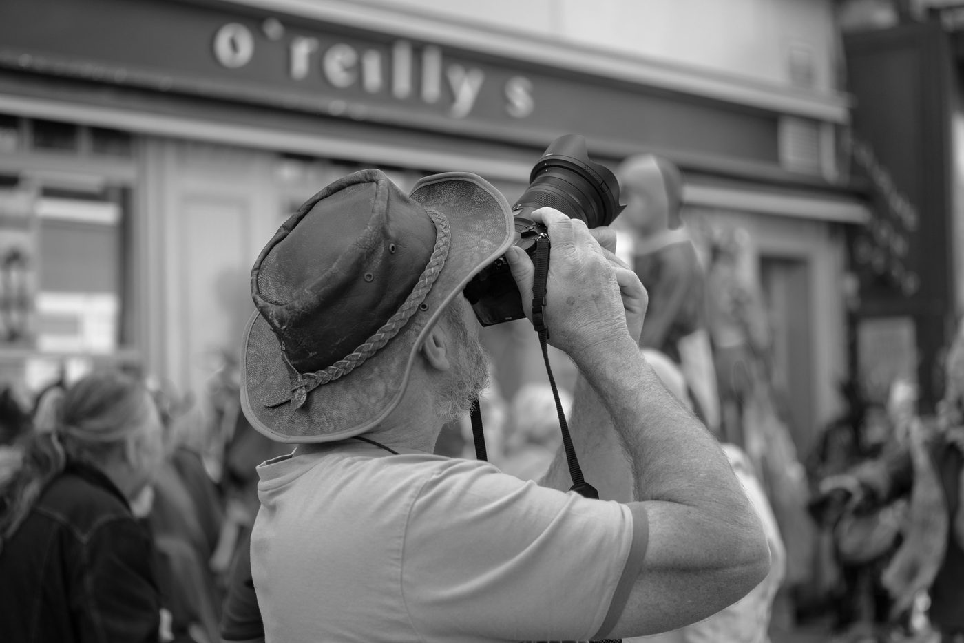 Photographer in action at the Zinneke Parade, Brussels (plate 032)