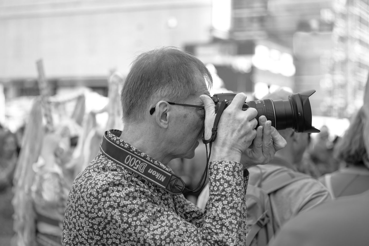 Photographer in action at the Zinneke Parade, Brussels (plate 033)