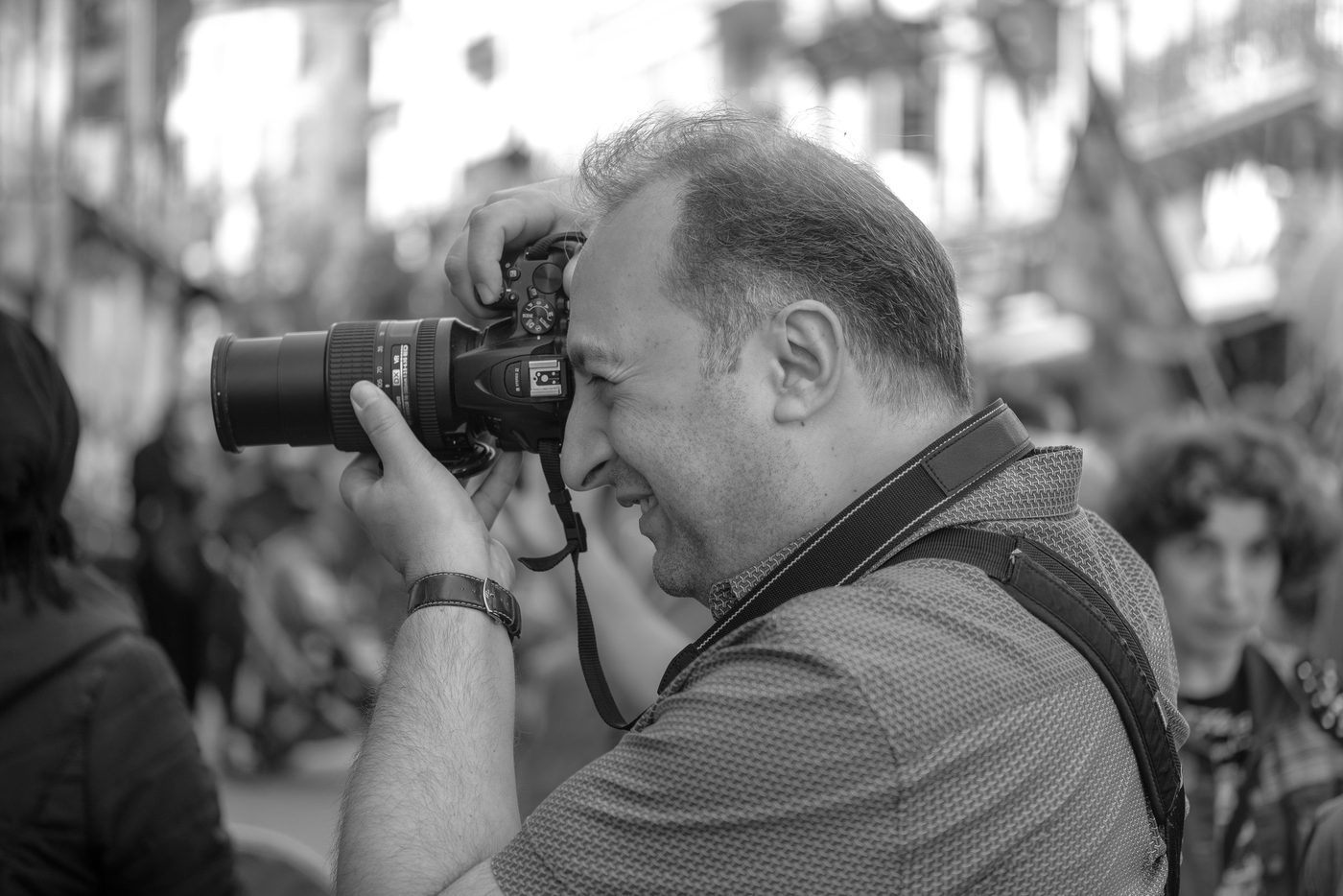 Photographer in action at the Zinneke Parade, Brussels (plate 037)