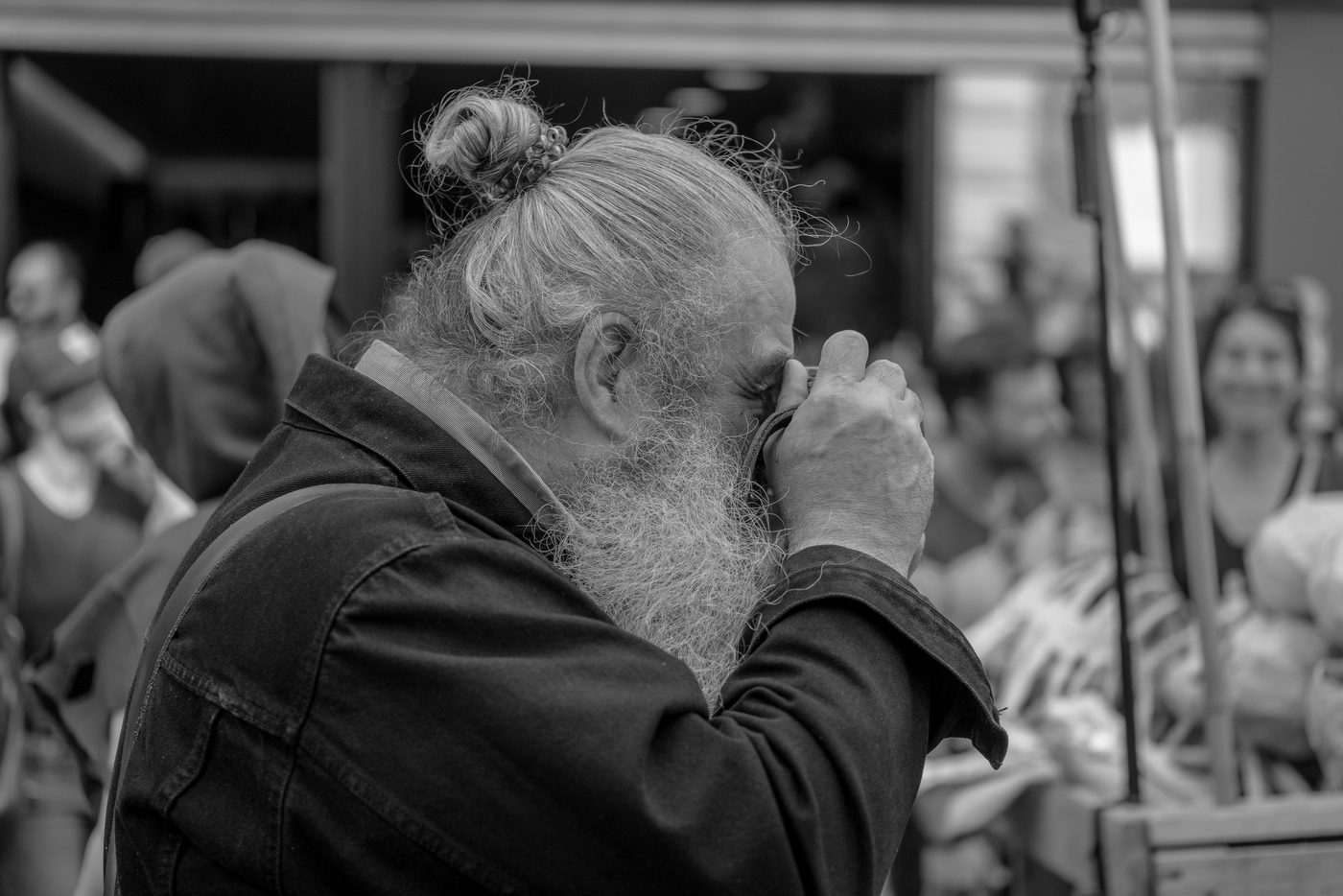 Photographer in action at the Zinneke Parade, Brussels (plate 039)