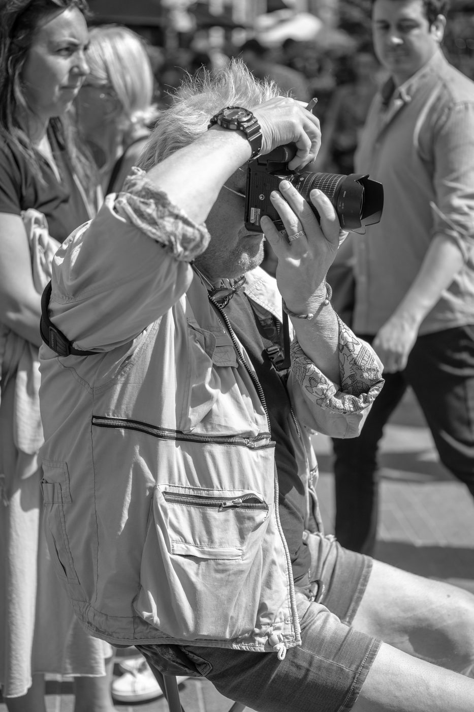 Photographer in action at the Zinneke Parade, Brussels (plate 041)