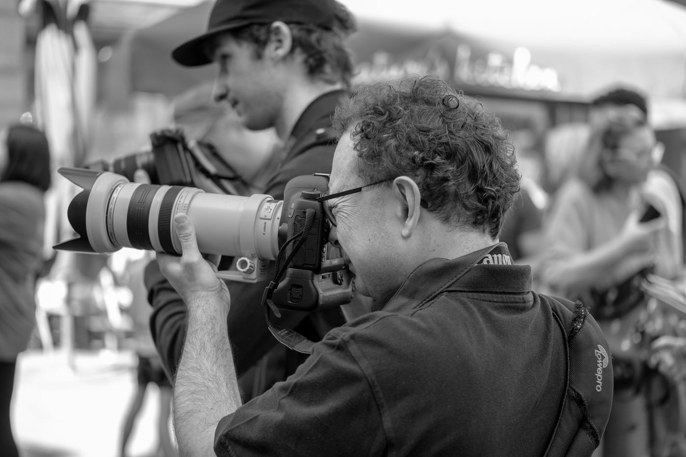 Photographer in action at the Zinneke Parade, Brussels (plate 047)