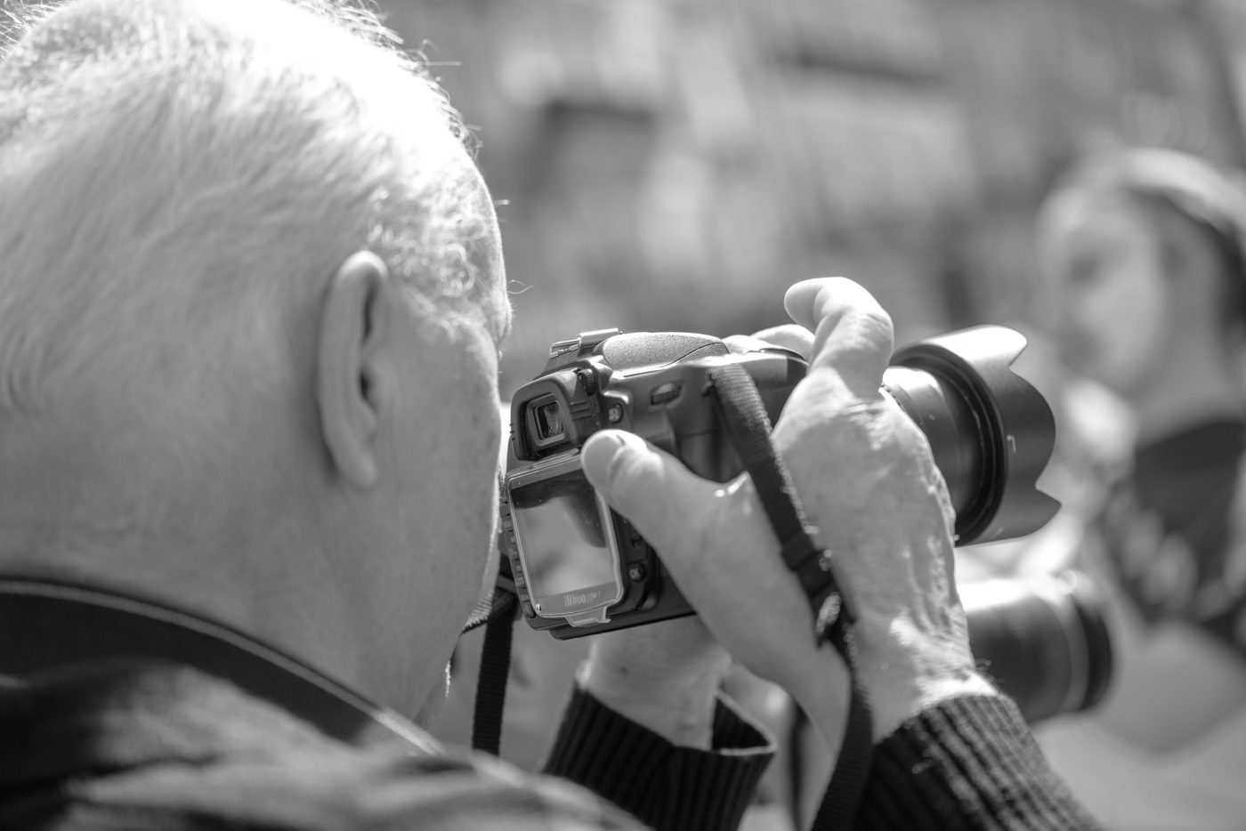 Photographer in action at the Zinneke Parade, Brussels (plate 054)