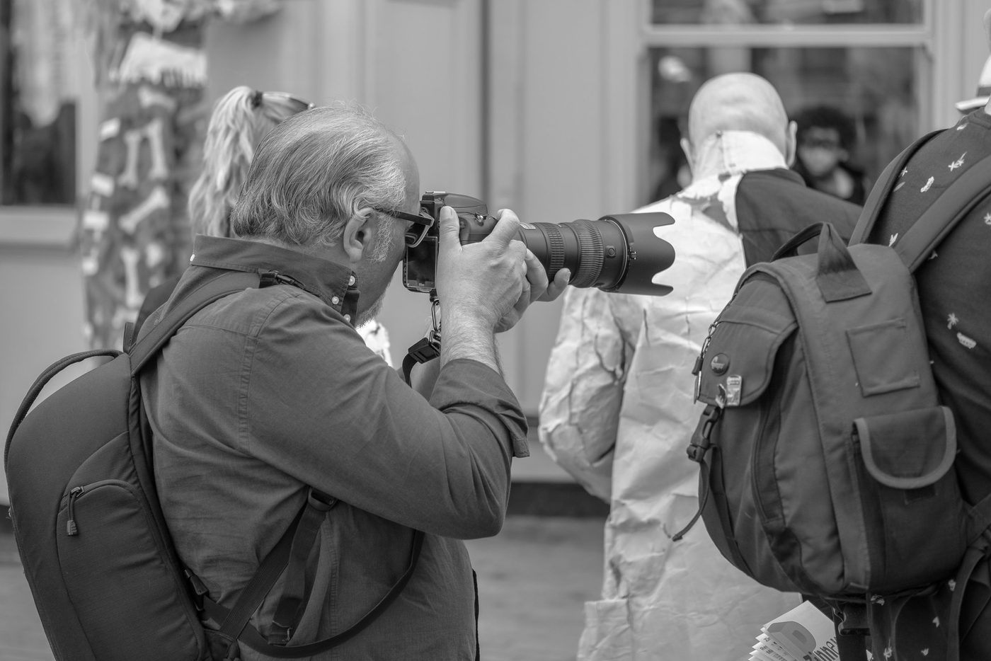 Photographer in action at the Zinneke Parade, Brussels (plate 058)