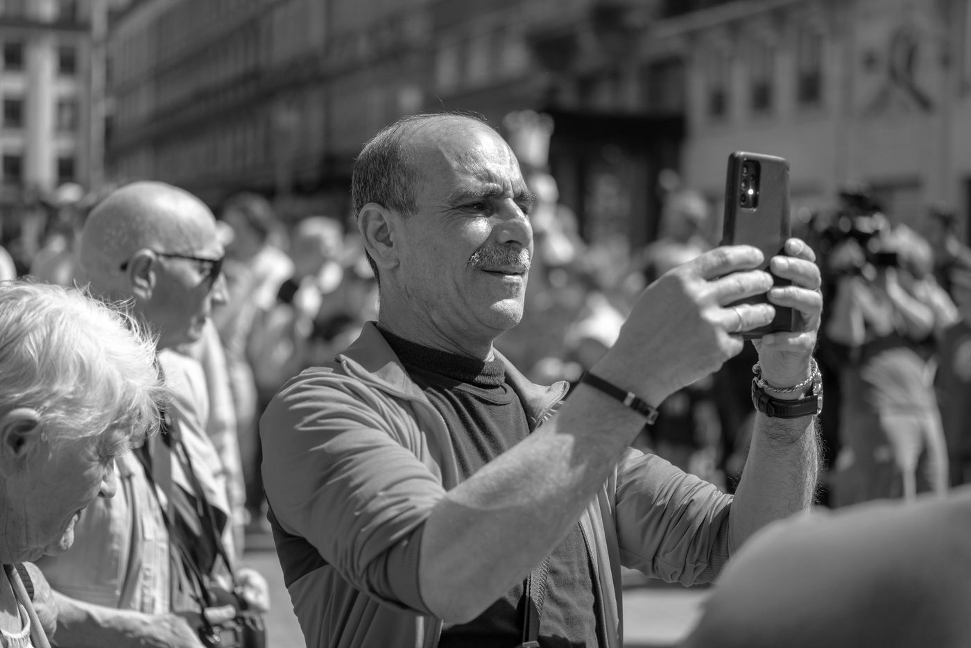 Photographer in action at the Zinneke Parade, Brussels (plate 061)