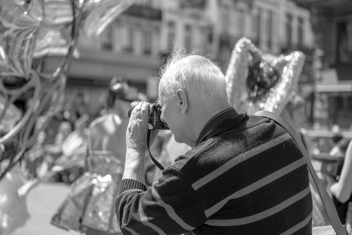 Photographer in action at the Zinneke Parade, Brussels (plate 066)