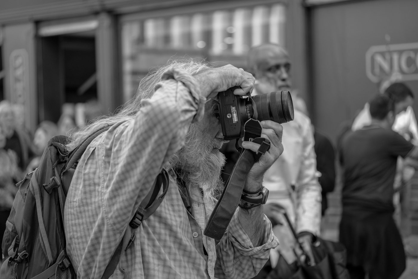 Photographer in action at the Zinneke Parade, Brussels (plate 067)