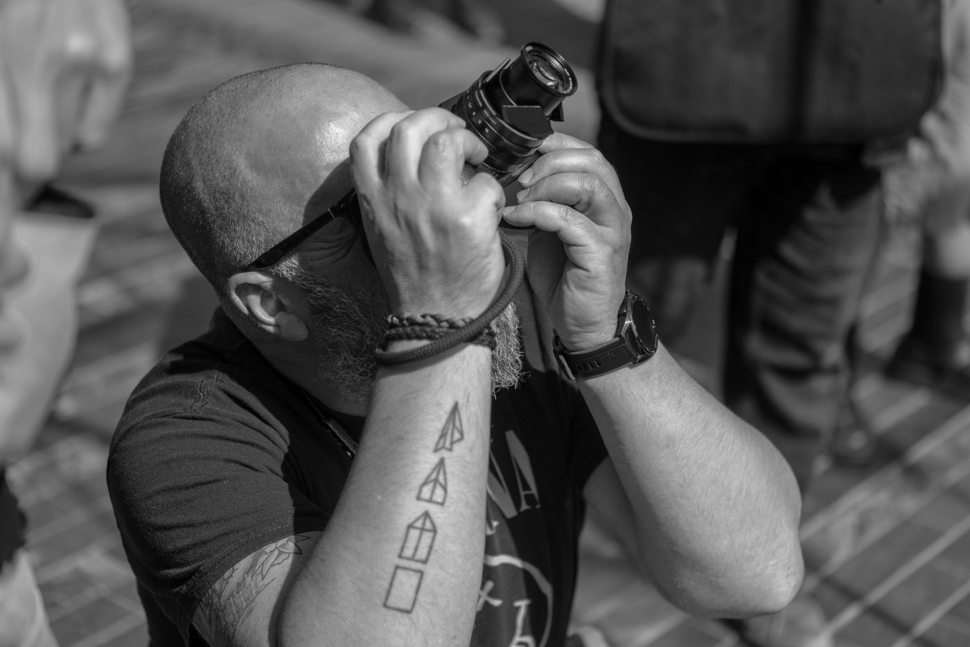 Photographer in action at the Zinneke Parade, Brussels (plate 068)