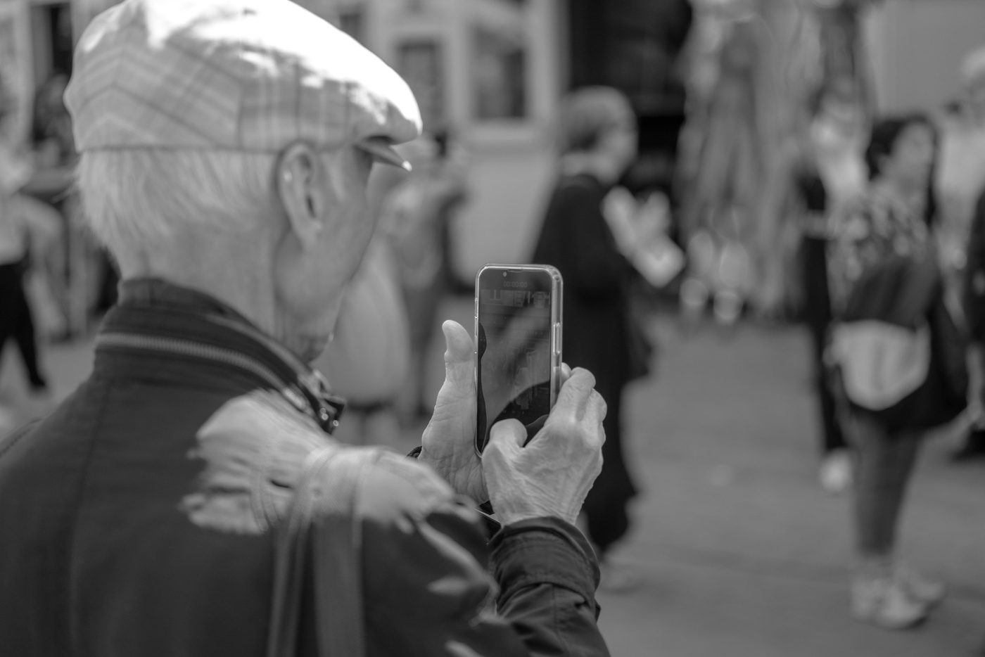 Photographer in action at the Zinneke Parade, Brussels (plate 069)