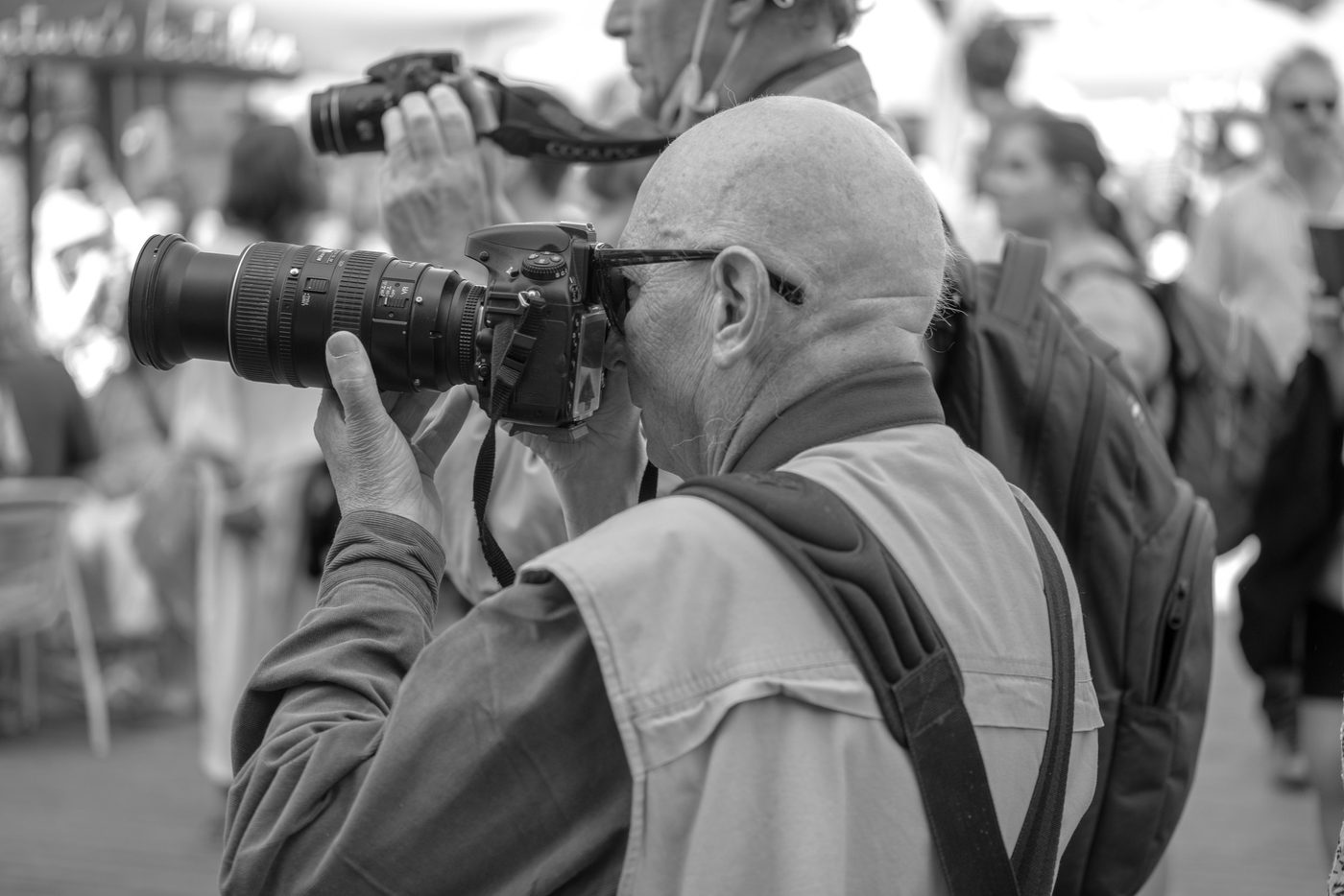 Photographer in action at the Zinneke Parade, Brussels (plate 072)