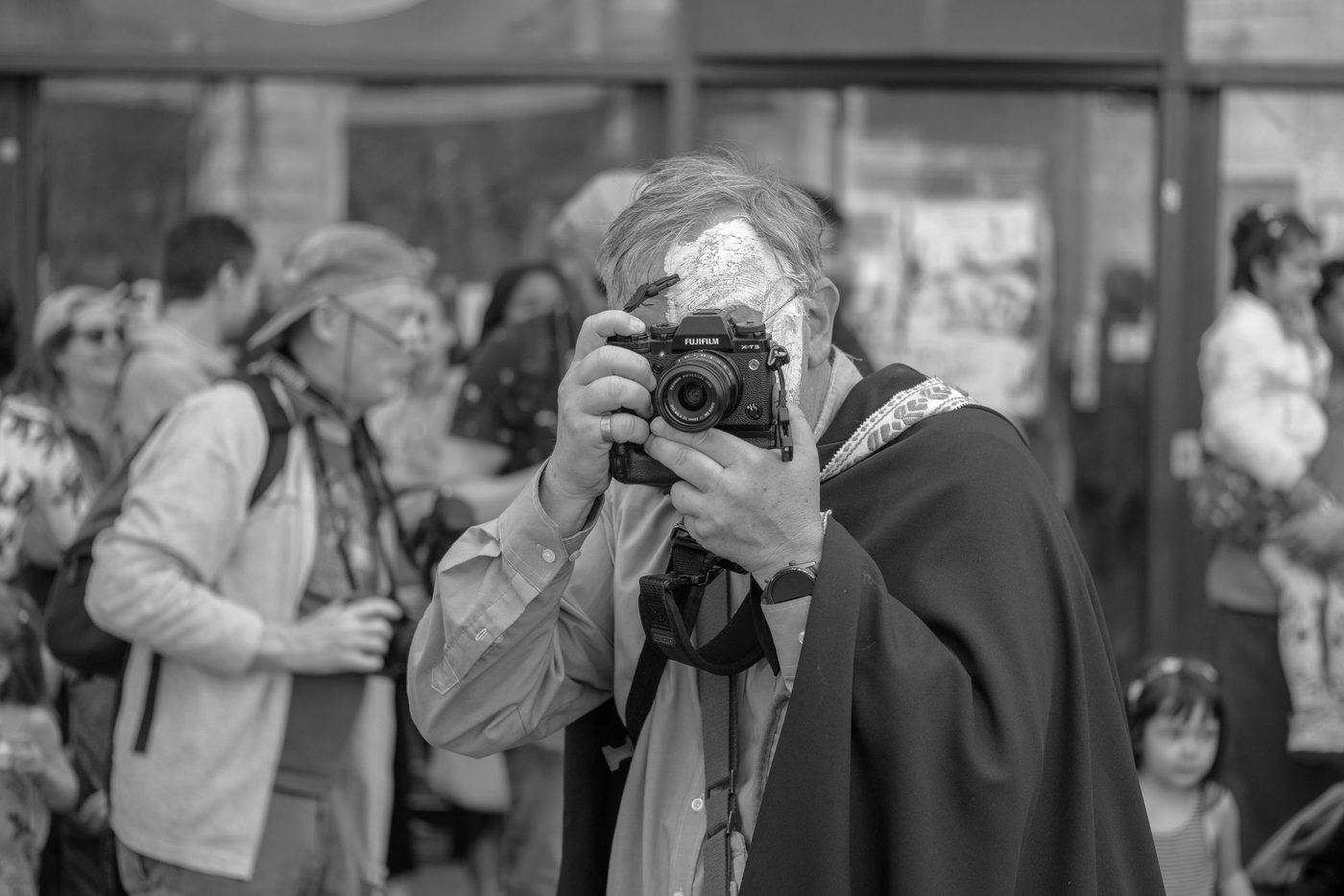 Photographer in action at the Zinneke Parade, Brussels (plate 084)