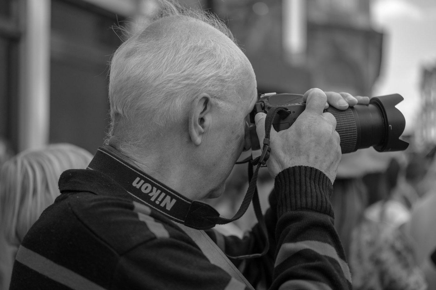 Photographer in action at the Zinneke Parade, Brussels (plate 085)
