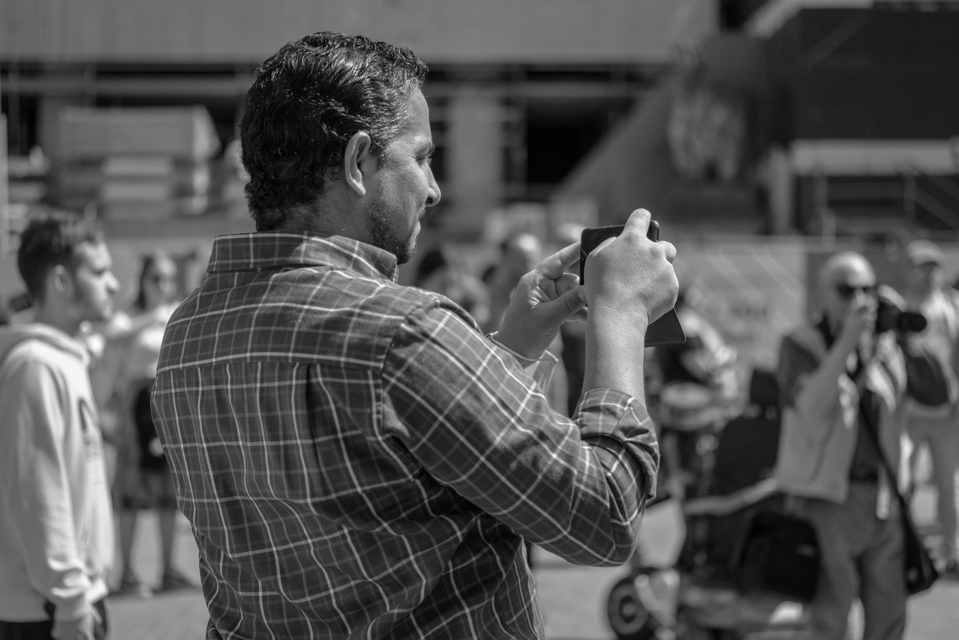 Photographer in action at the Zinneke Parade, Brussels (plate 099)