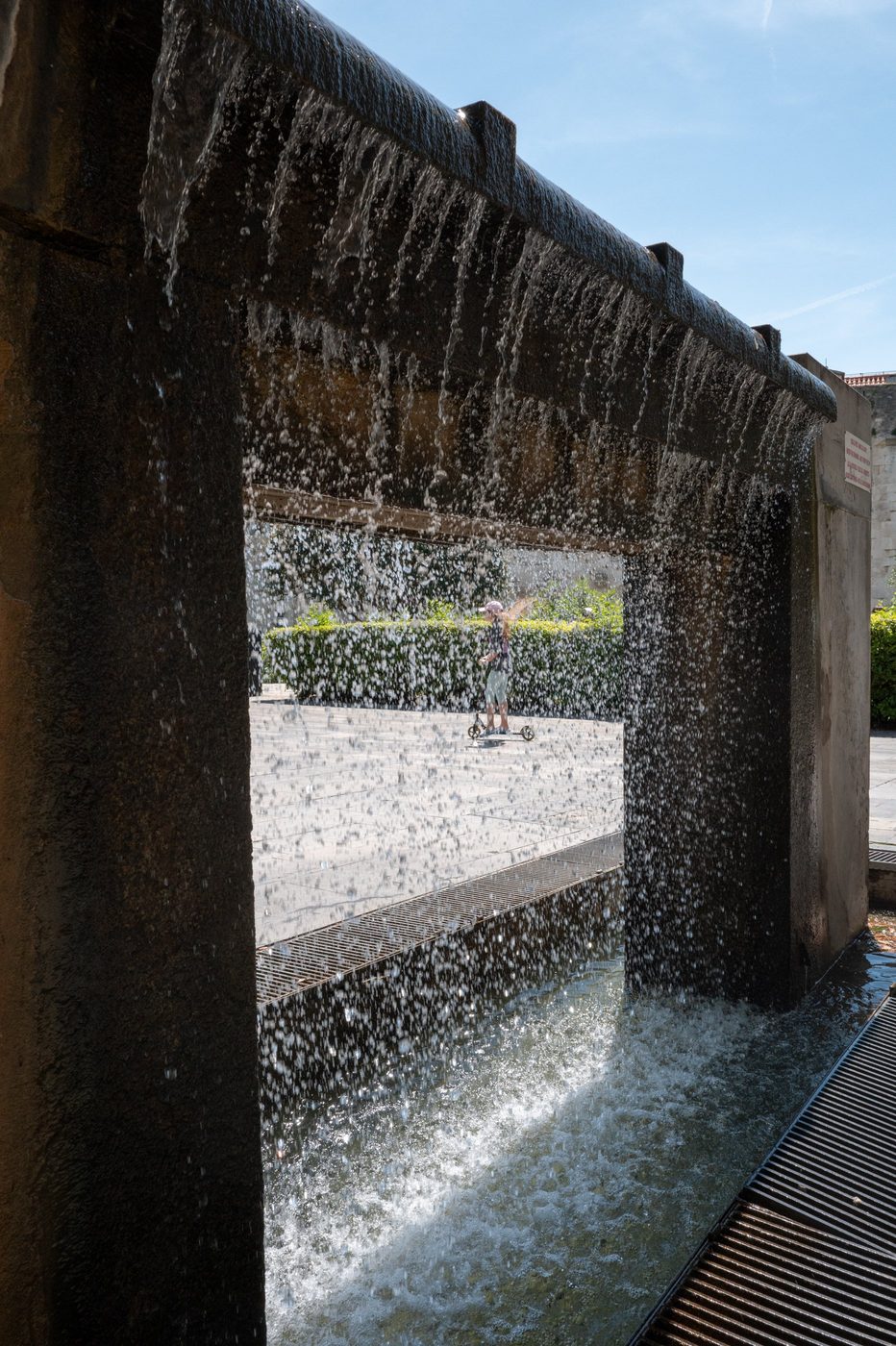 Cascading fountain with a scooter rider in the background, Split