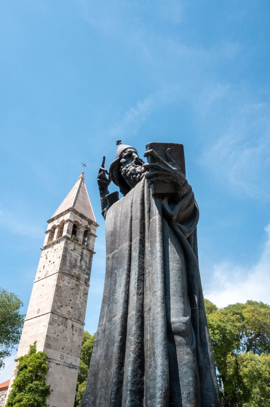 Statue of Gregory of Nin pointing toward the sky near the bell tower, Split