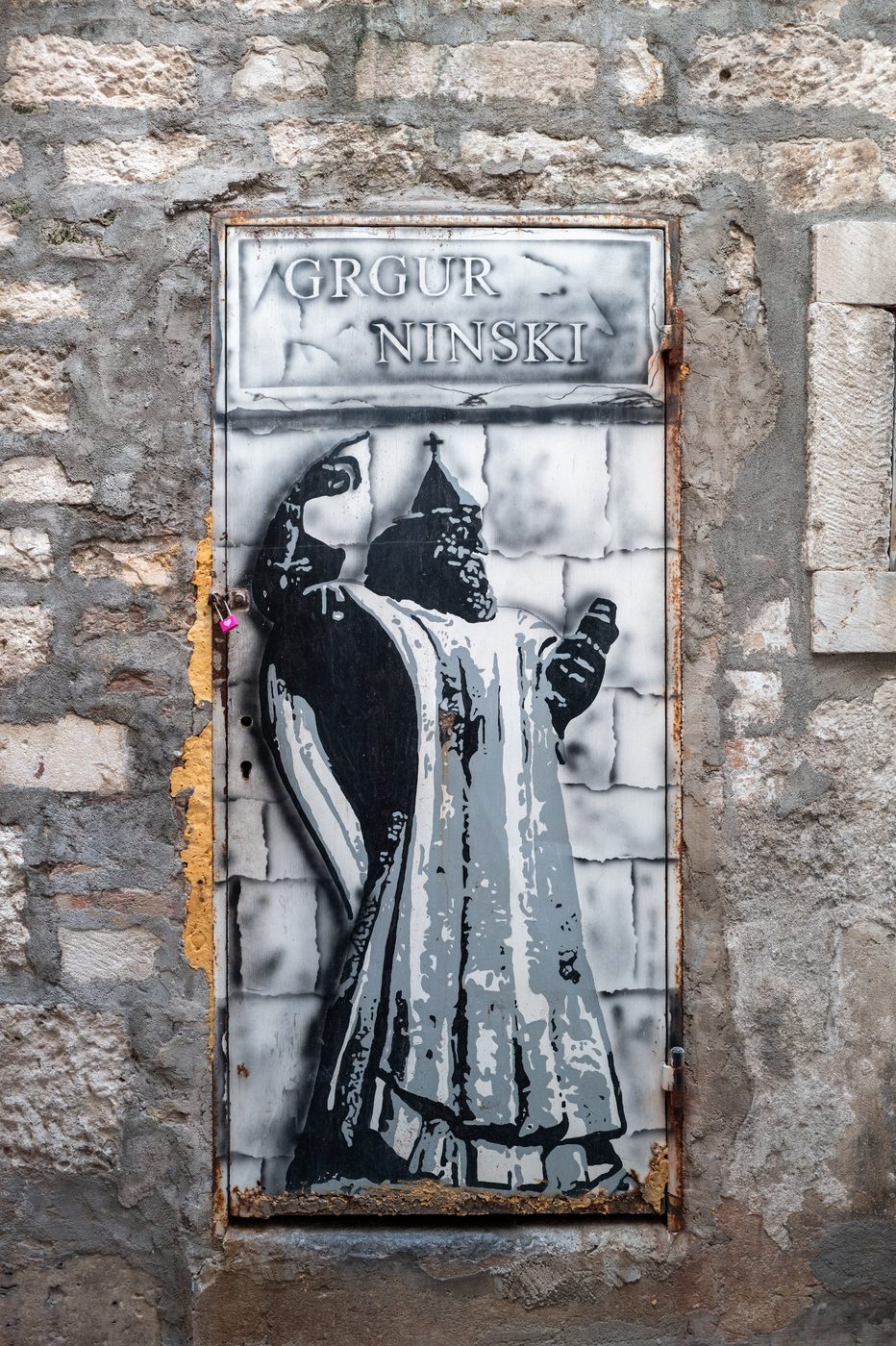 Metal door painted with the likeness of Grgur Ninski, Split