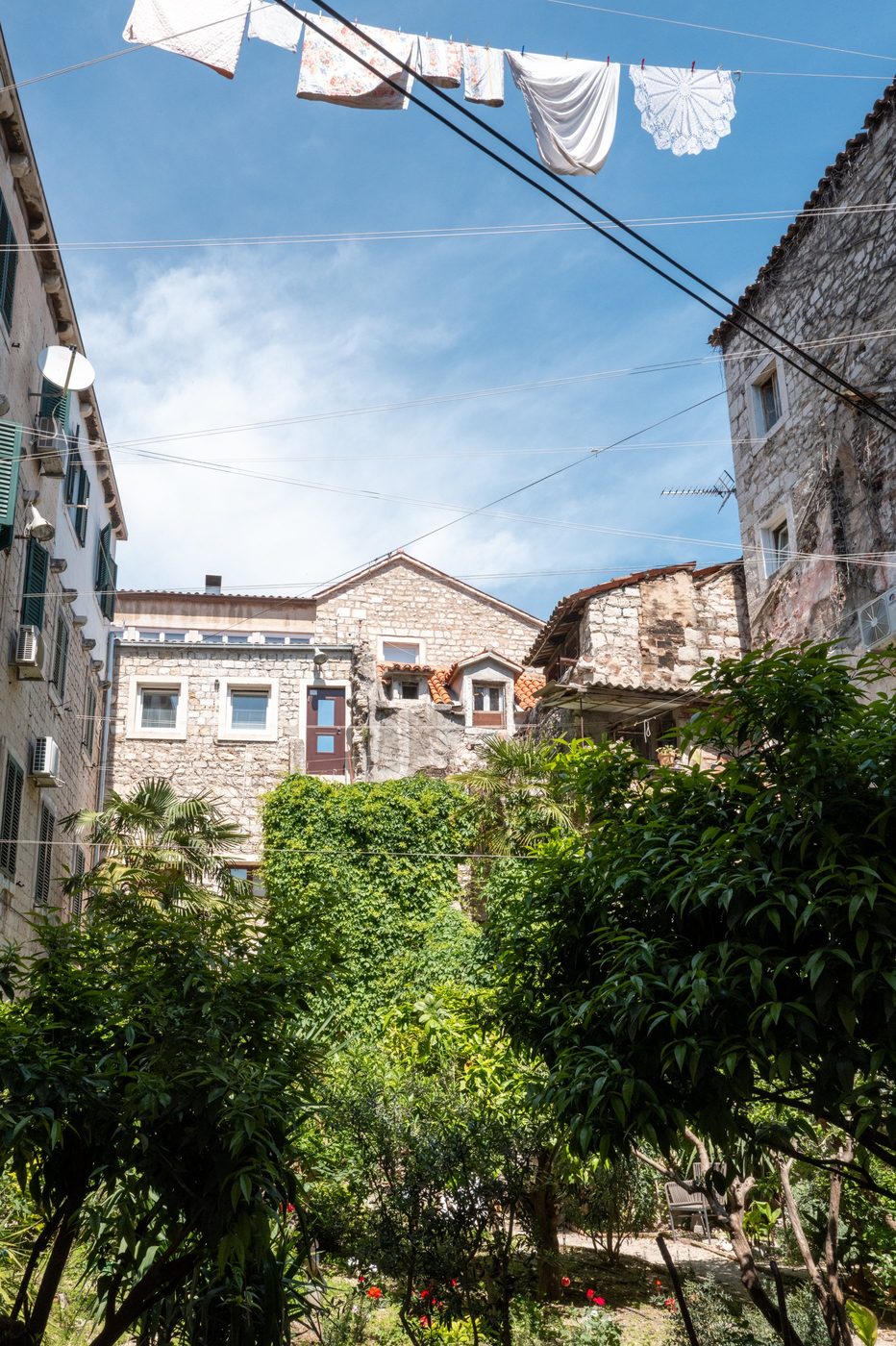 White sheets hung above the rooftops and gardens of the old town, Split