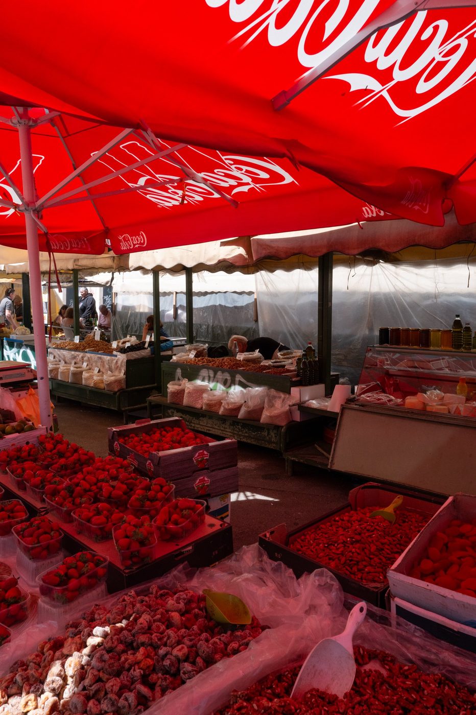 Stall of strawberries and dried fruit under a Coca-Cola parasol, Split