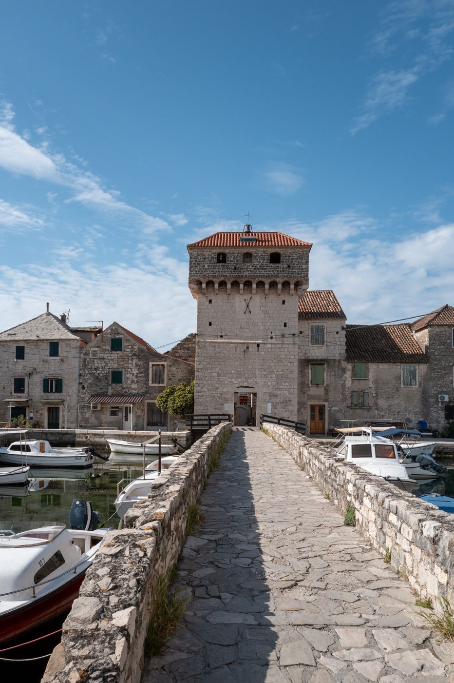 Stone footbridge leading to the fortified harbor tower, Trogir
