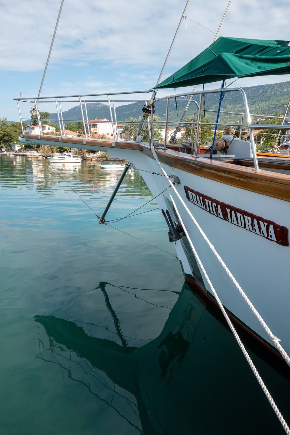Bow of the sailboat Kraljica Jadrana anchored near the shore, Trogir