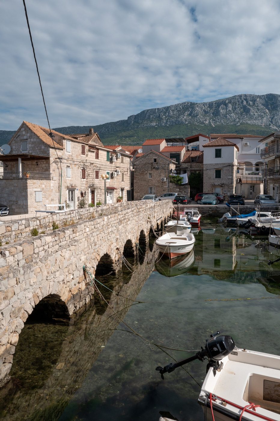 Small stone bridge spanning the boat-lined canal, Trogir