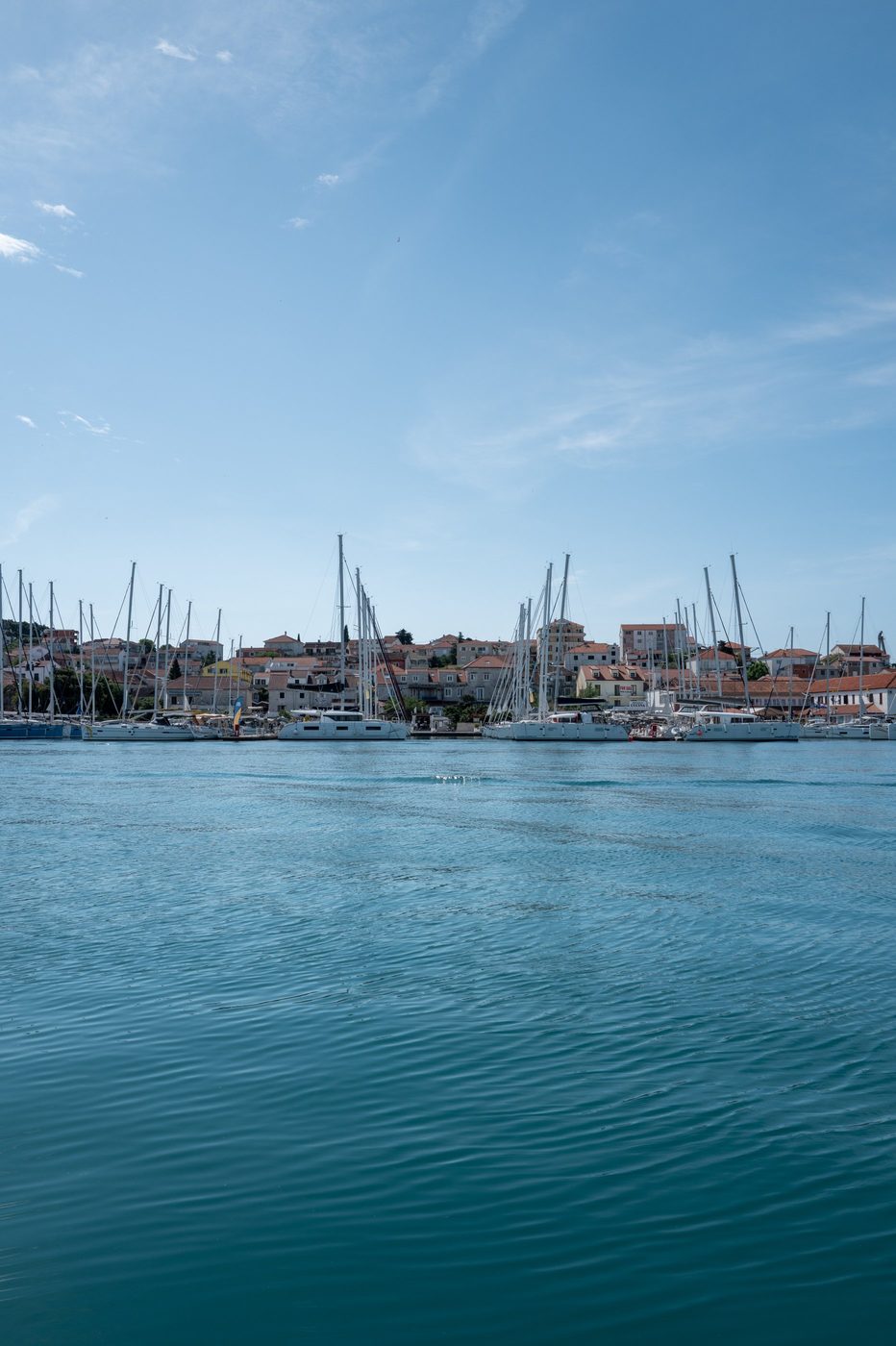Yachts at the dock with a for-sale sign displayed at the harbor, Trogir
