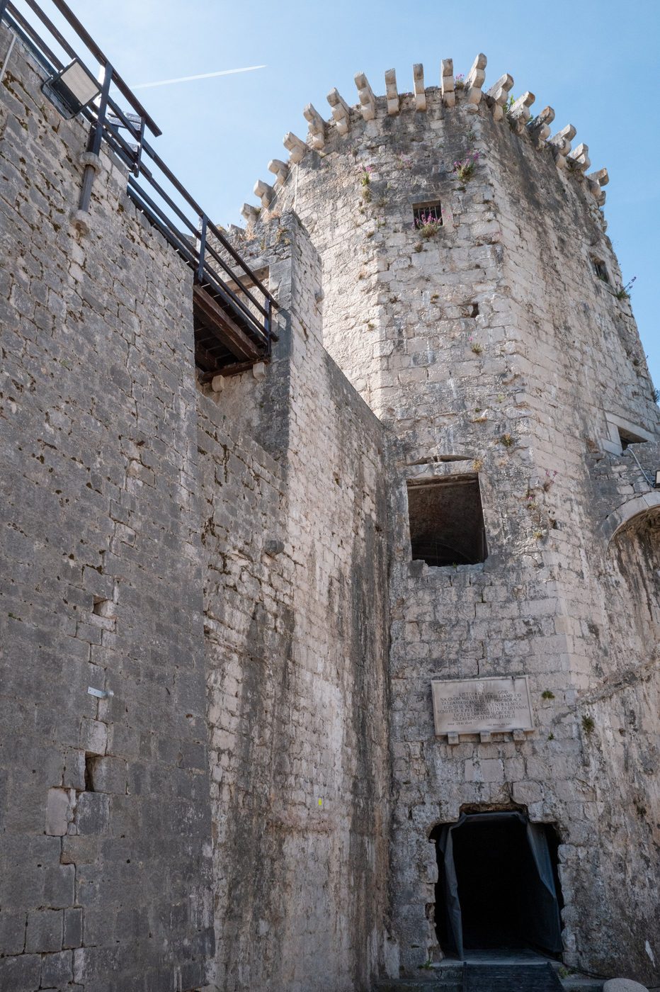 Vaulted entrance at the foot of the fortress's crenellated tower, Trogir