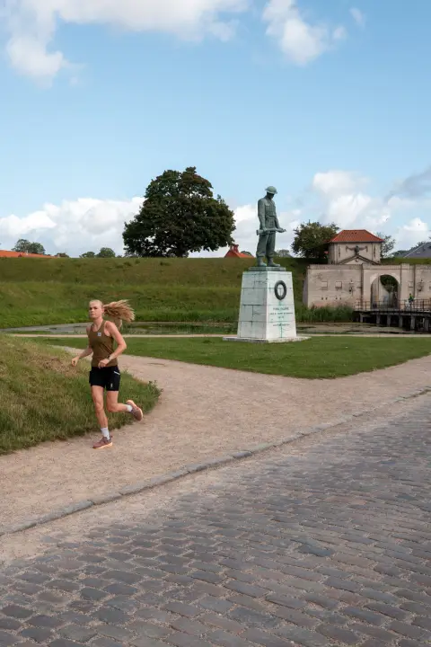 A runner passing a statue, Kastellet, Copenhagen