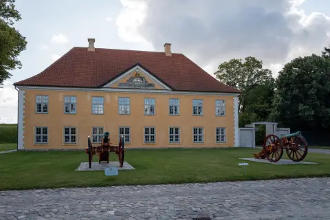 Two cannons in front of a yellow house with a red roof, Kastellet, Copenhagen