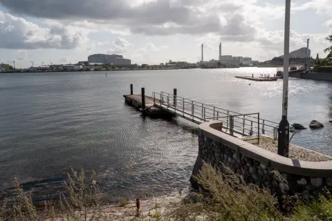 A pontoon at the edge of the harbour, chimneys in the distance, Copenhagen