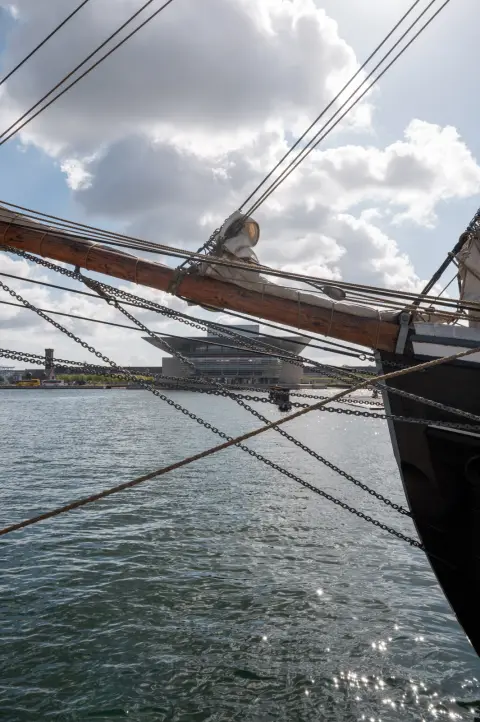 The rigging of a tall ship, the harbour behind, Copenhagen