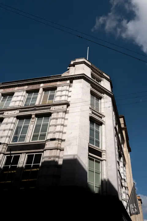 The corner of a stone building against a deep blue sky, Copenhagen