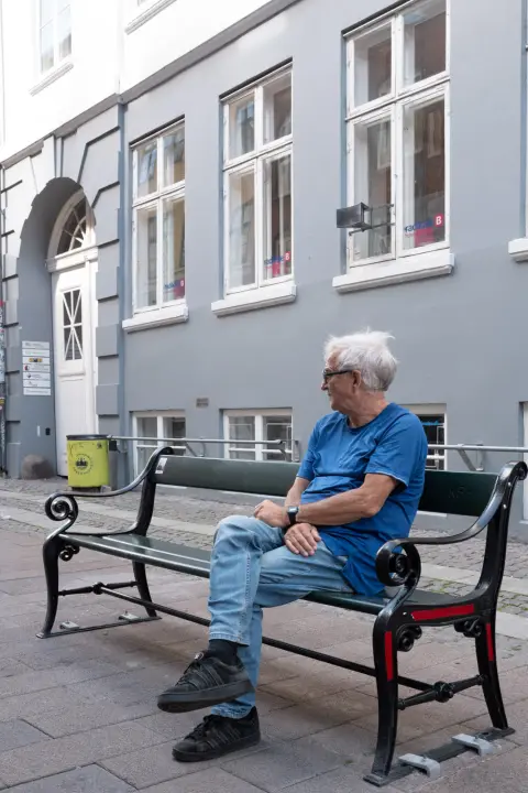 An old man in blue sitting on a bench, Copenhagen