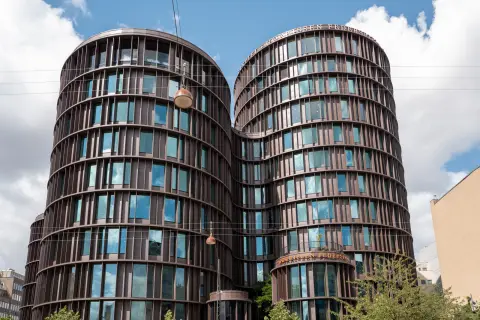 Two round copper-clad towers under the clouds, Copenhagen