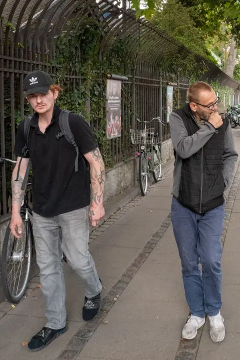 Two men walking along a railing, Copenhagen