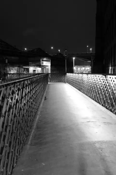 Footbridge with lattice railings at night, Edinburgh