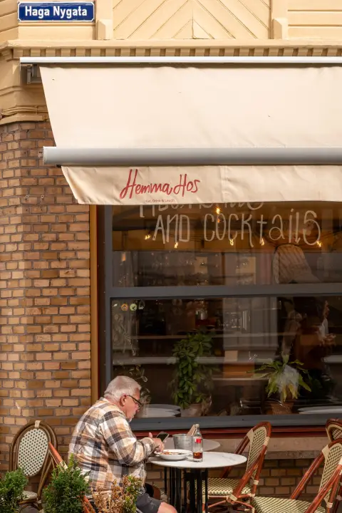 A man alone at a terrace table, Haga Nygata, Gothenburg