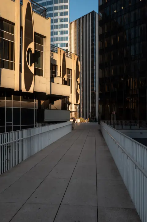 An empty footbridge between the towers in the evening light, Paris