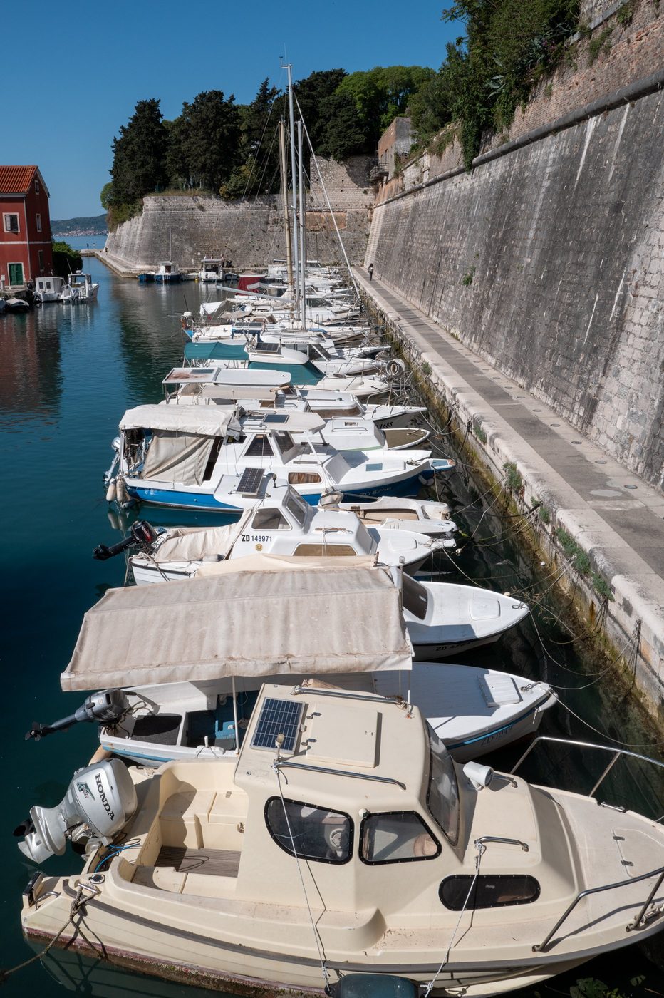 Row of boats moored along the fortified quay, Zadar