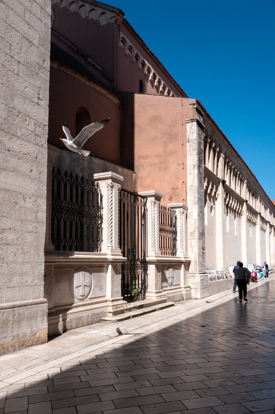 Wrought-iron gate adorned with a cross in front of St. Mary's Church, Zadar