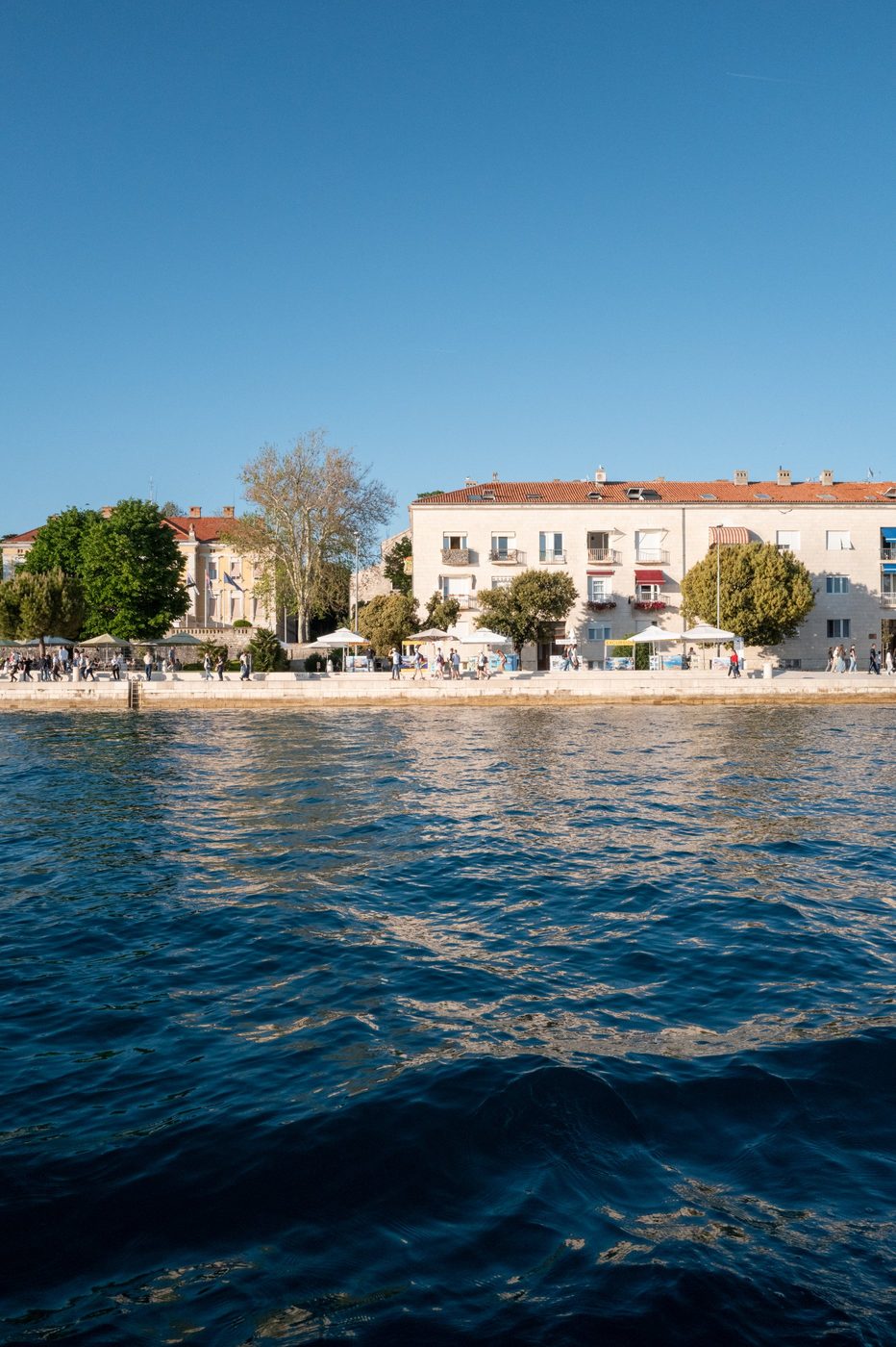 Lively promenade along the white seafront buildings, Zadar