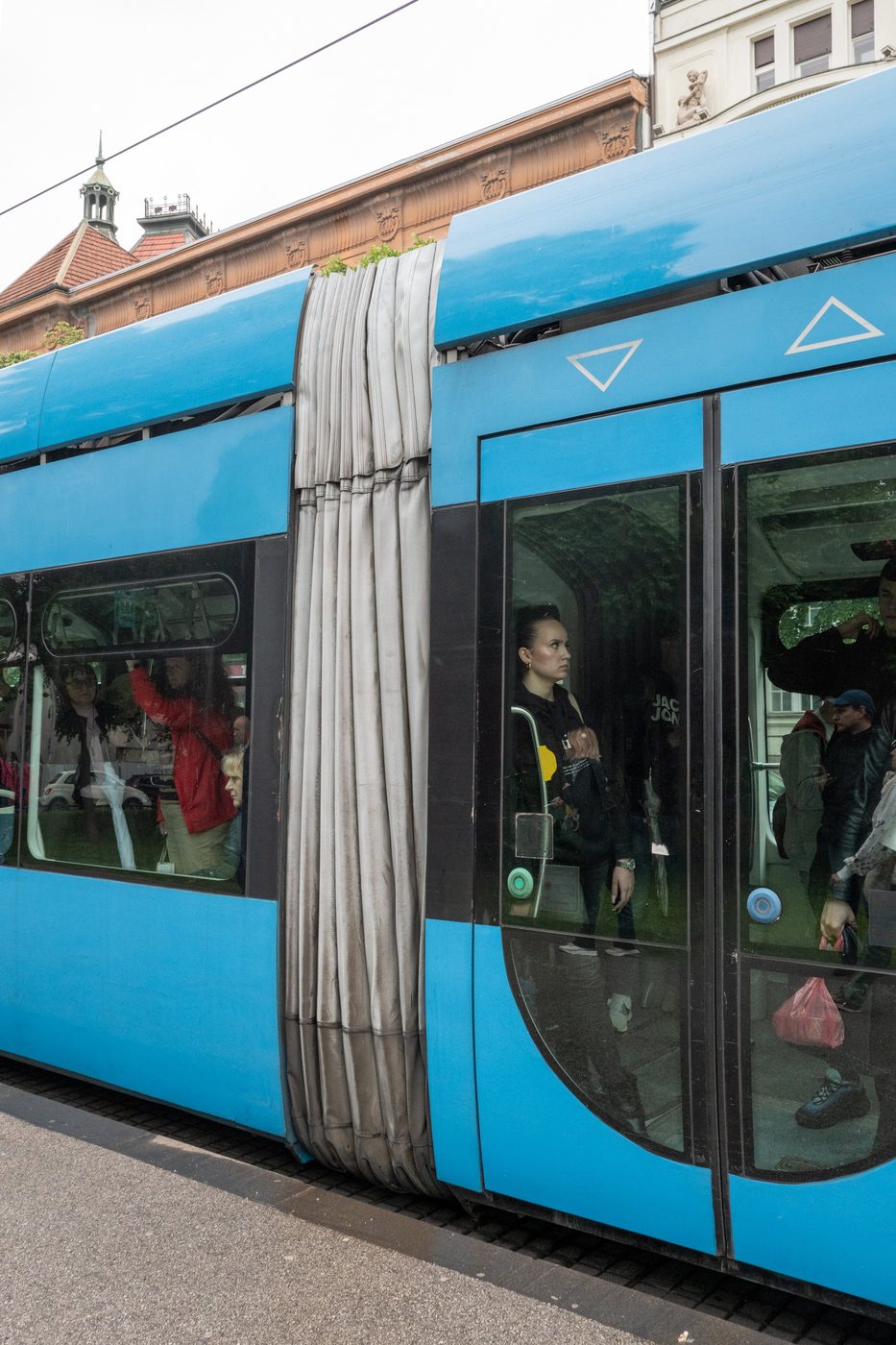 Articulated bellows between two cars of a blue tram, Zagreb