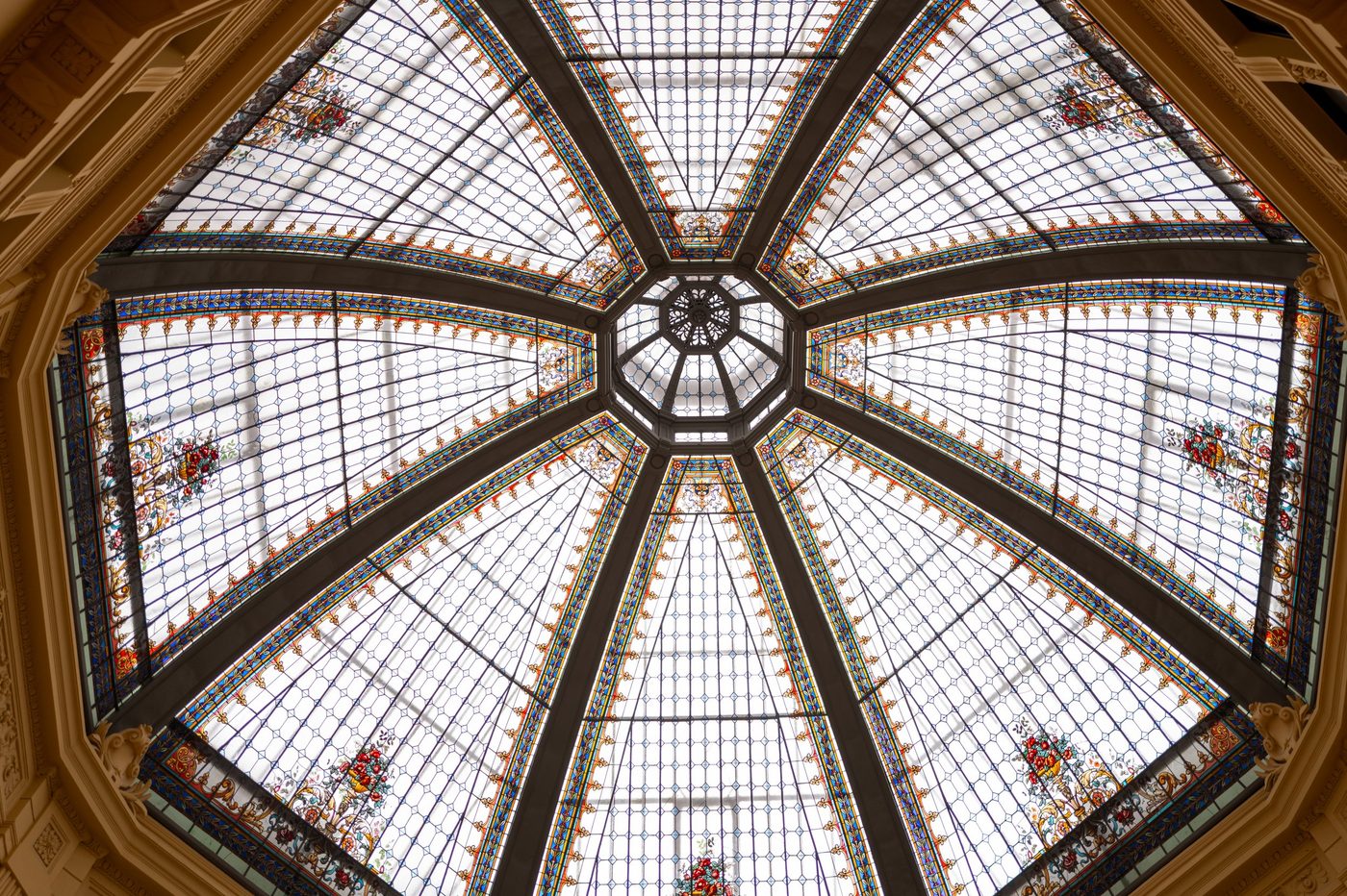 Octagonal stained-glass roof with floral pattern in the Oktogon arcade, Zagreb
