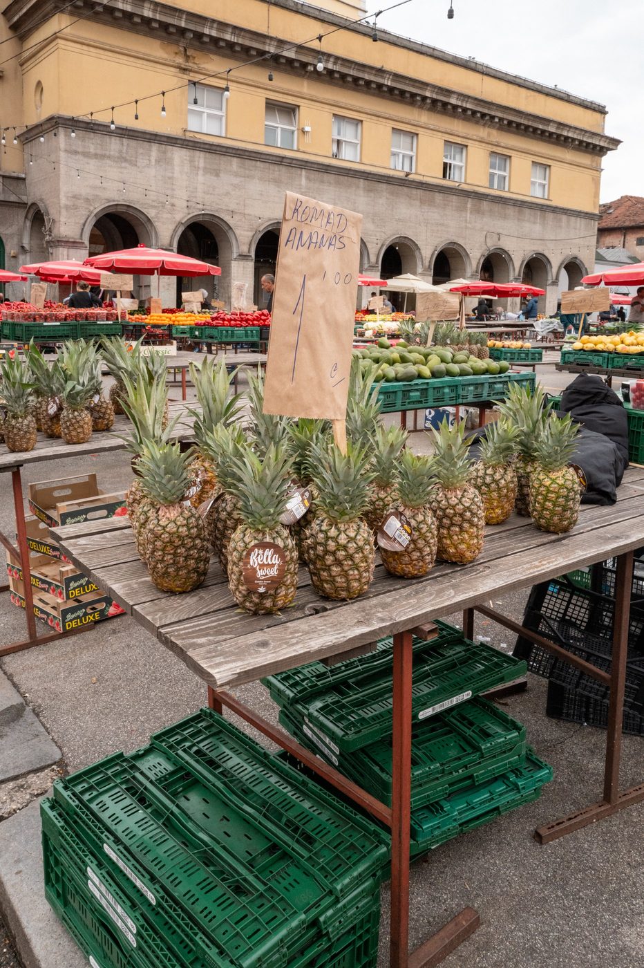 Stall of stacked pineapples in front of the Dolac market arcades, Zagreb