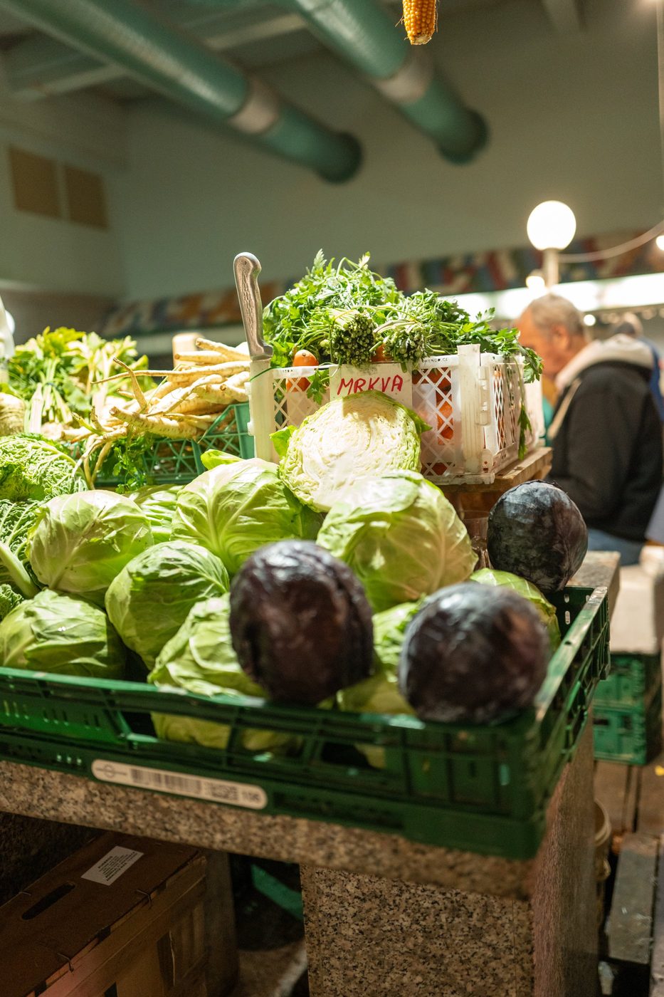 Green and red cabbages stacked in crates at the market, Zagreb