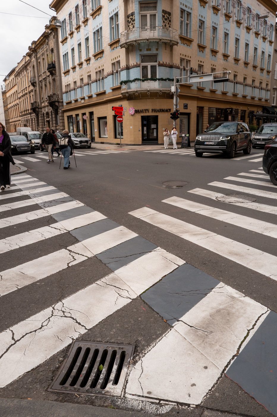 Black-and-white checkered crosswalk in front of an Art Nouveau building, Zagreb